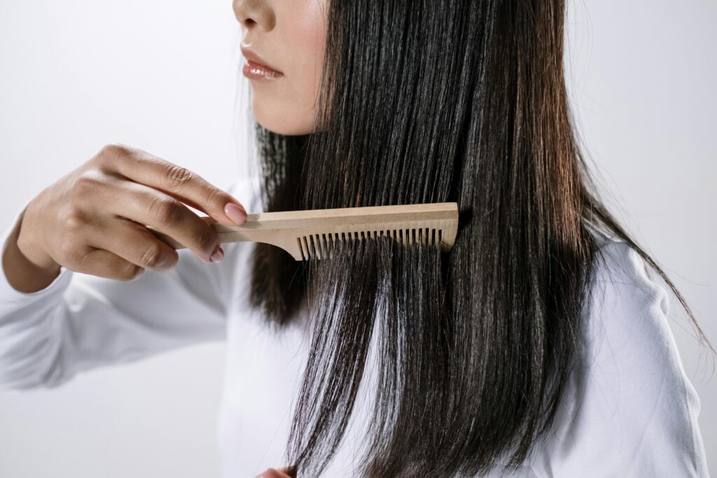 Women Combing her hair 